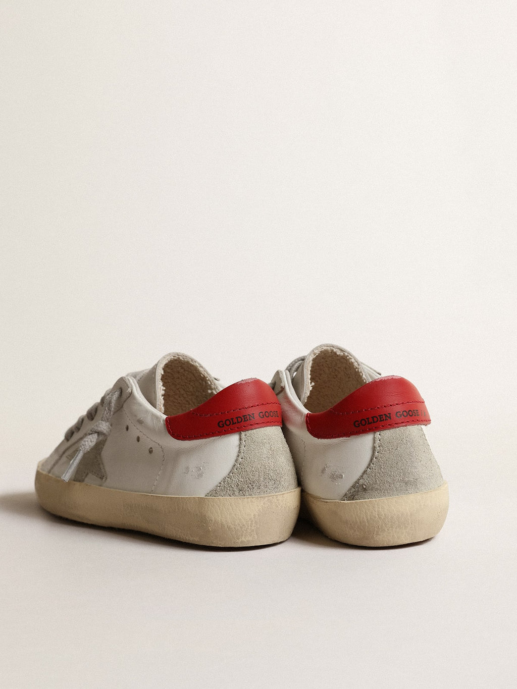 Super-Star Junior with suede star and red leather heel tab| Golden Goose