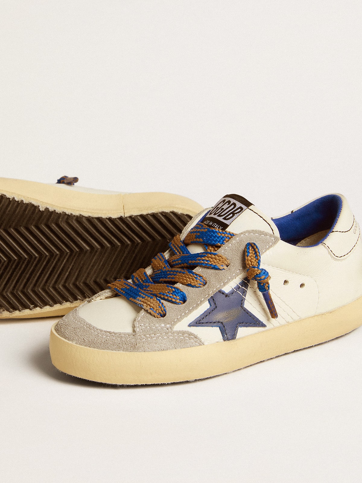 Super-Star Junior with blue leather star and ice-gray suede inserts| Golden Goose