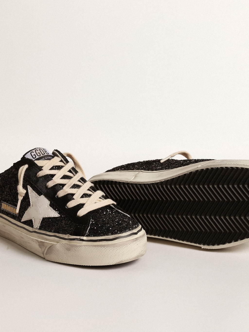 Super-Star Sabots in black glitter with white bio-based star| Golden Goose
