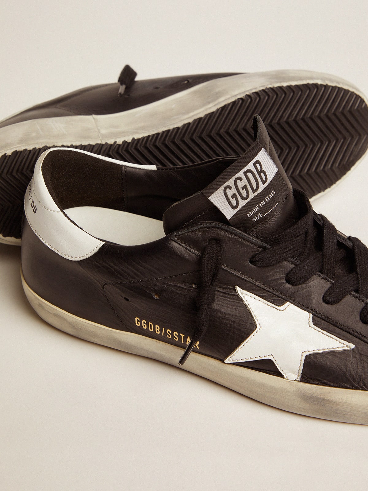 Women's Super-Star in black leather with white leather star and heel tab| Golden Goose