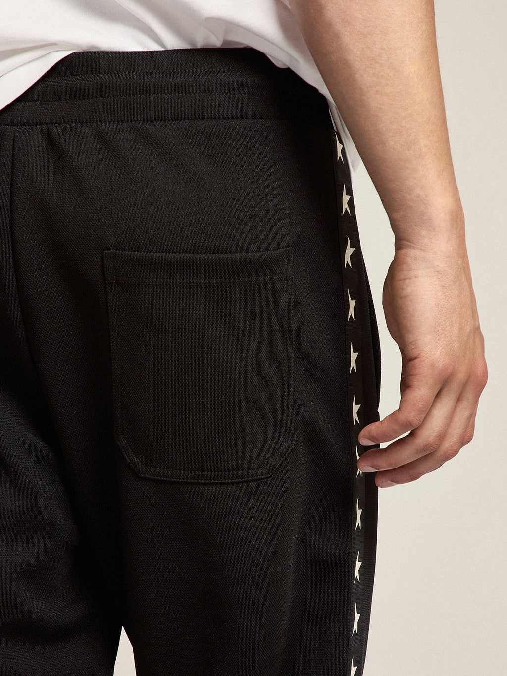 Men's black joggers with white stars on the sides| Golden Goose