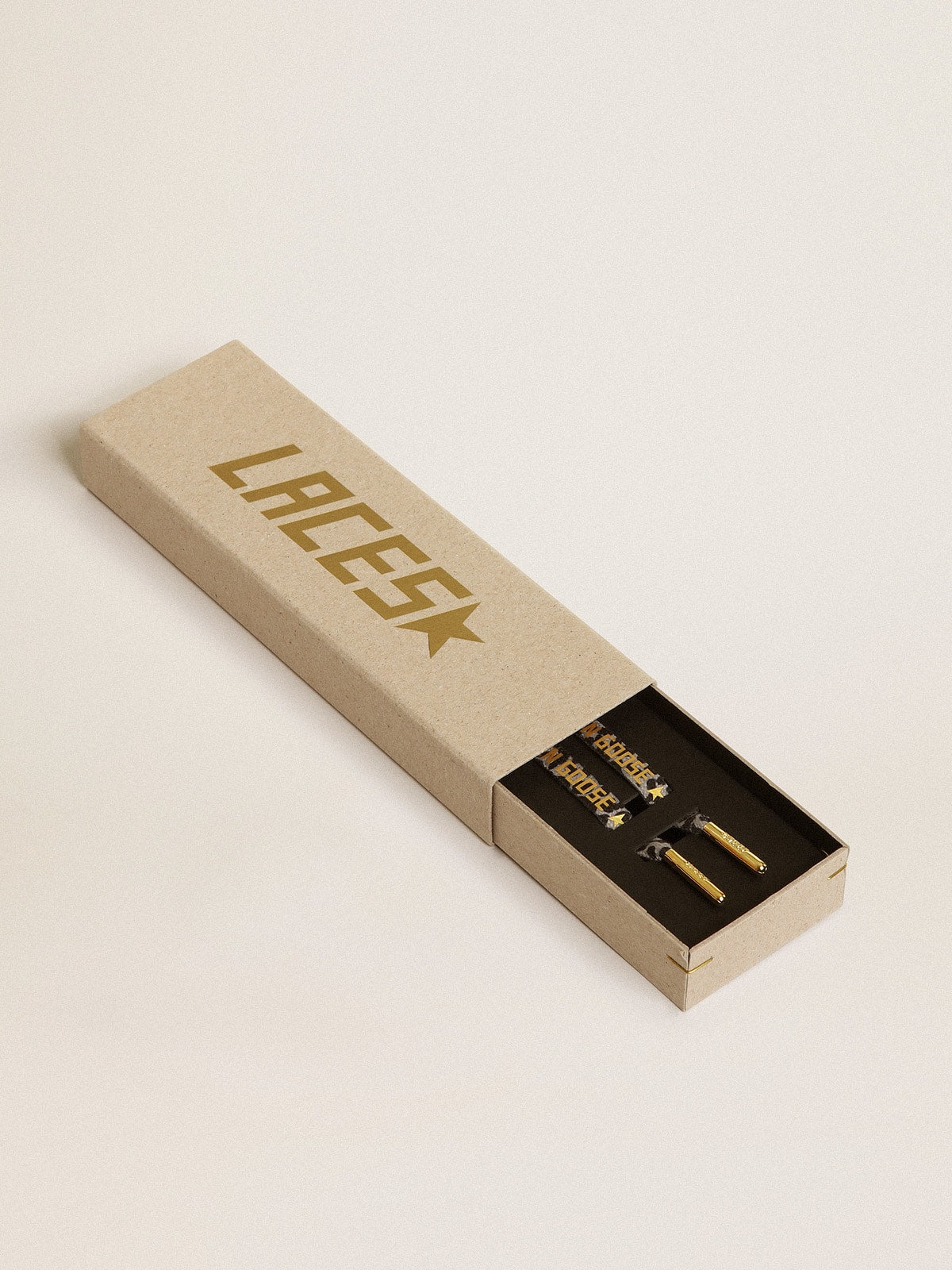 Gray and black animal-print laces with contrasting gold logo| Golden Goose