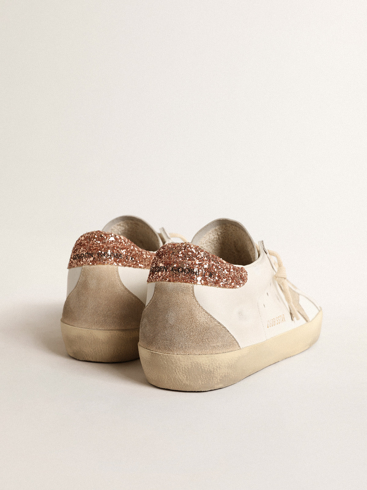 Super-Star with a suede star and peach-pink glitter heel tab| Golden Goose