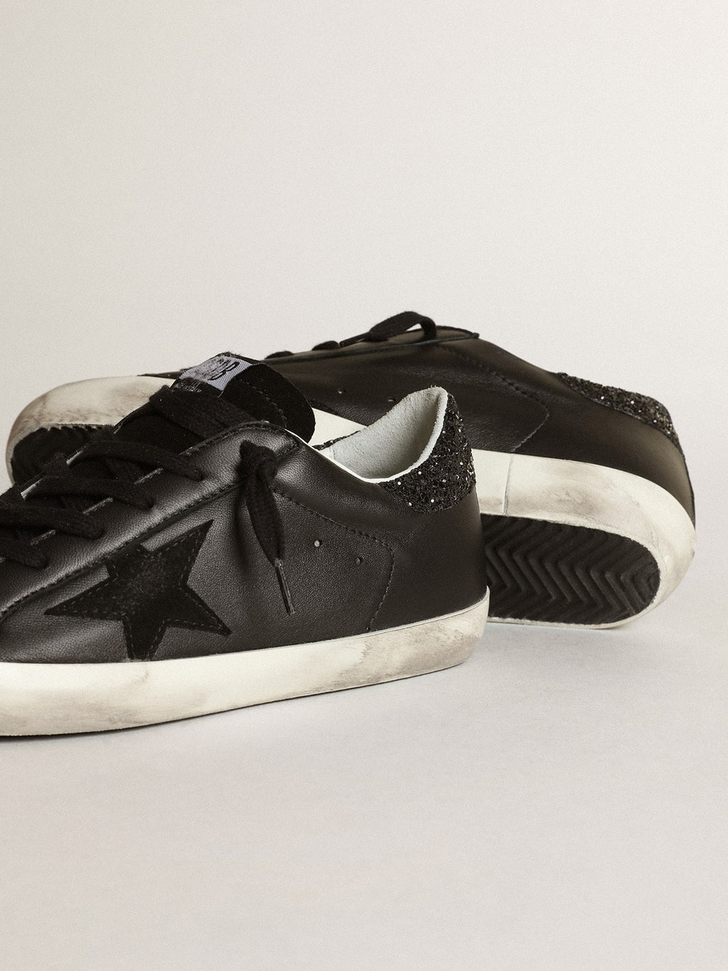 Women's Super-Star in black nappa with black star and glitter heel tab| Golden Goose