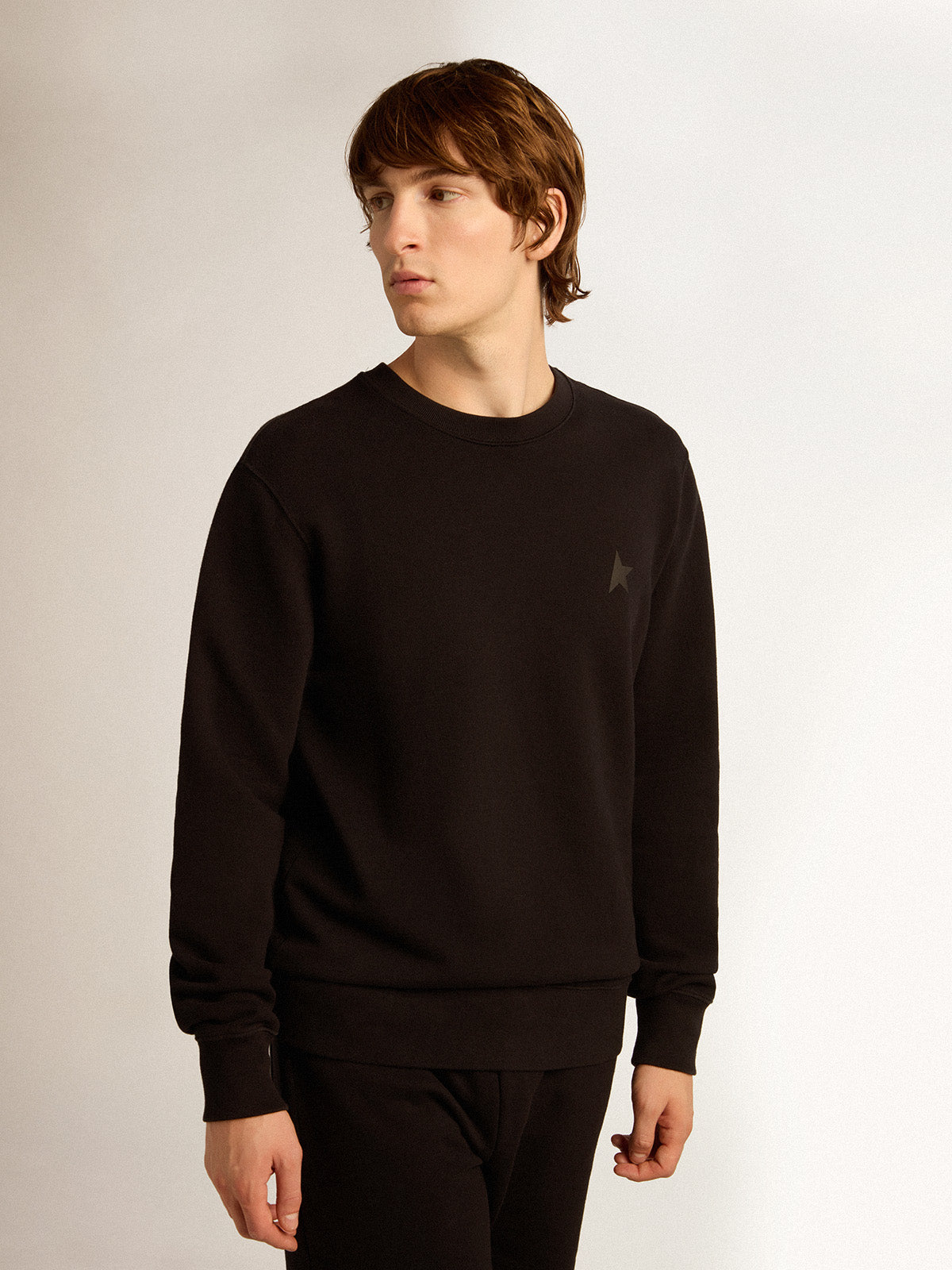 Black Archibald Star Collection sweatshirt with tone-on-tone star on the front| Golden Goose