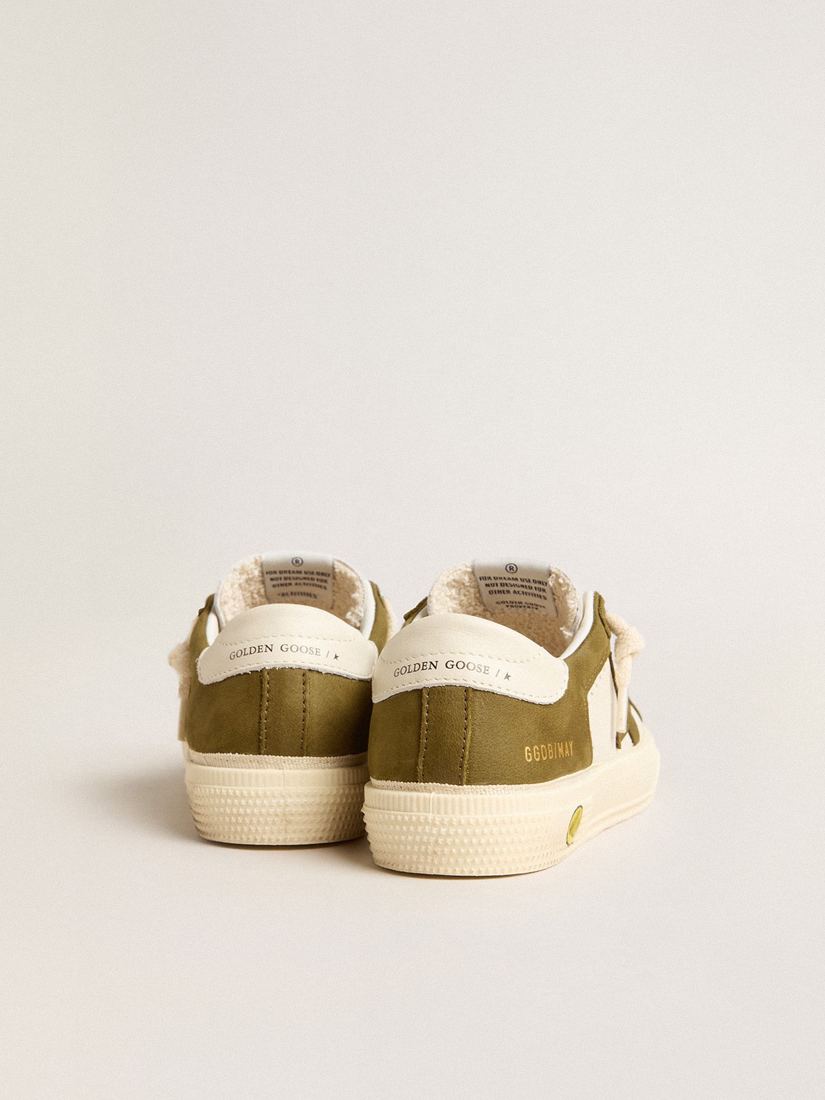 May Young in white and military green leather| Golden Goose