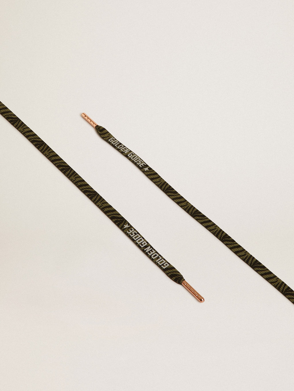 Green and black zebra-print laces with contrasting silver-colored logo| Golden Goose