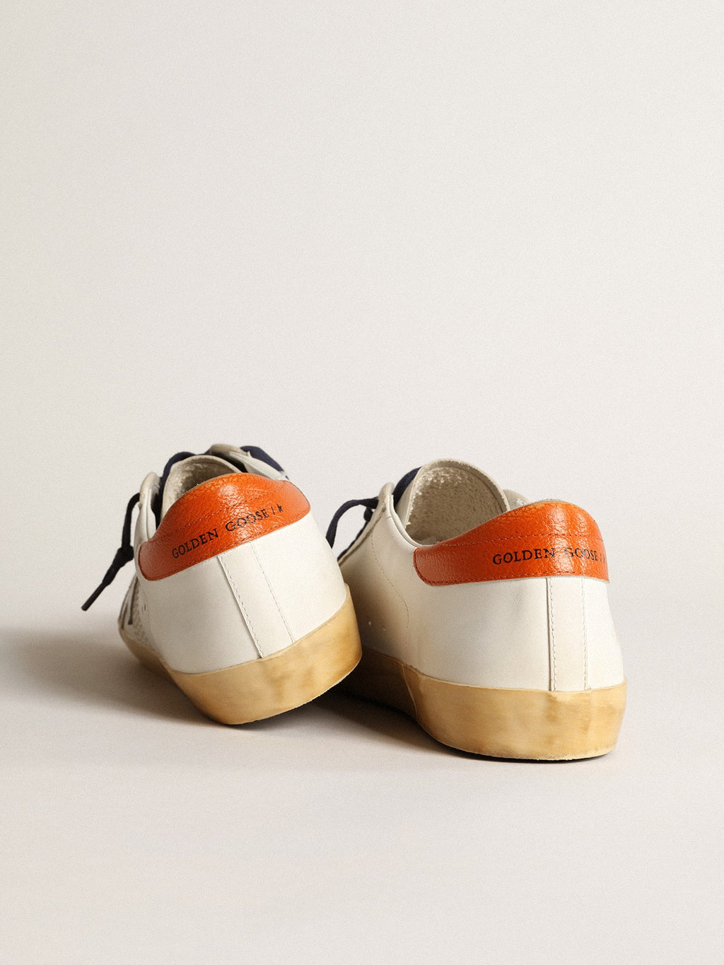 Super-Star Penstar with silver star and orange heel tab| Golden Goose