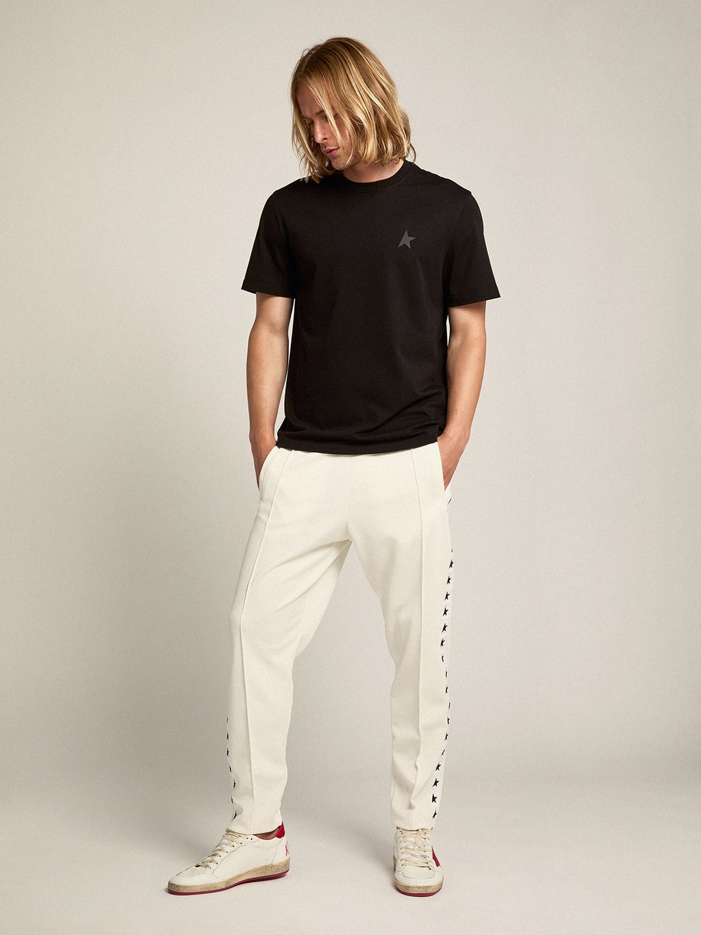 Men's white joggers with black stars on the sides| Golden Goose