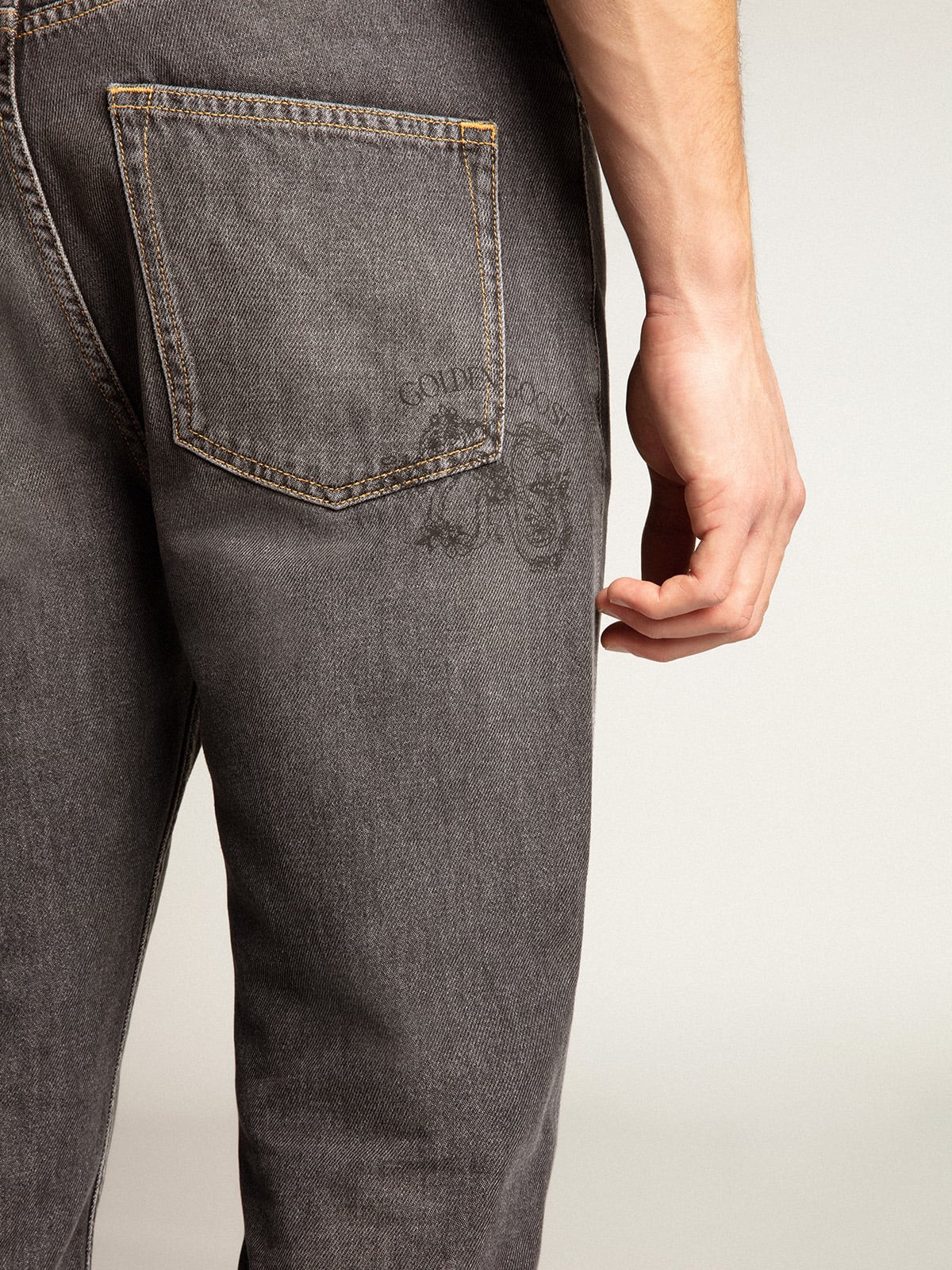 Men's black jeans with printed pocket| Golden Goose