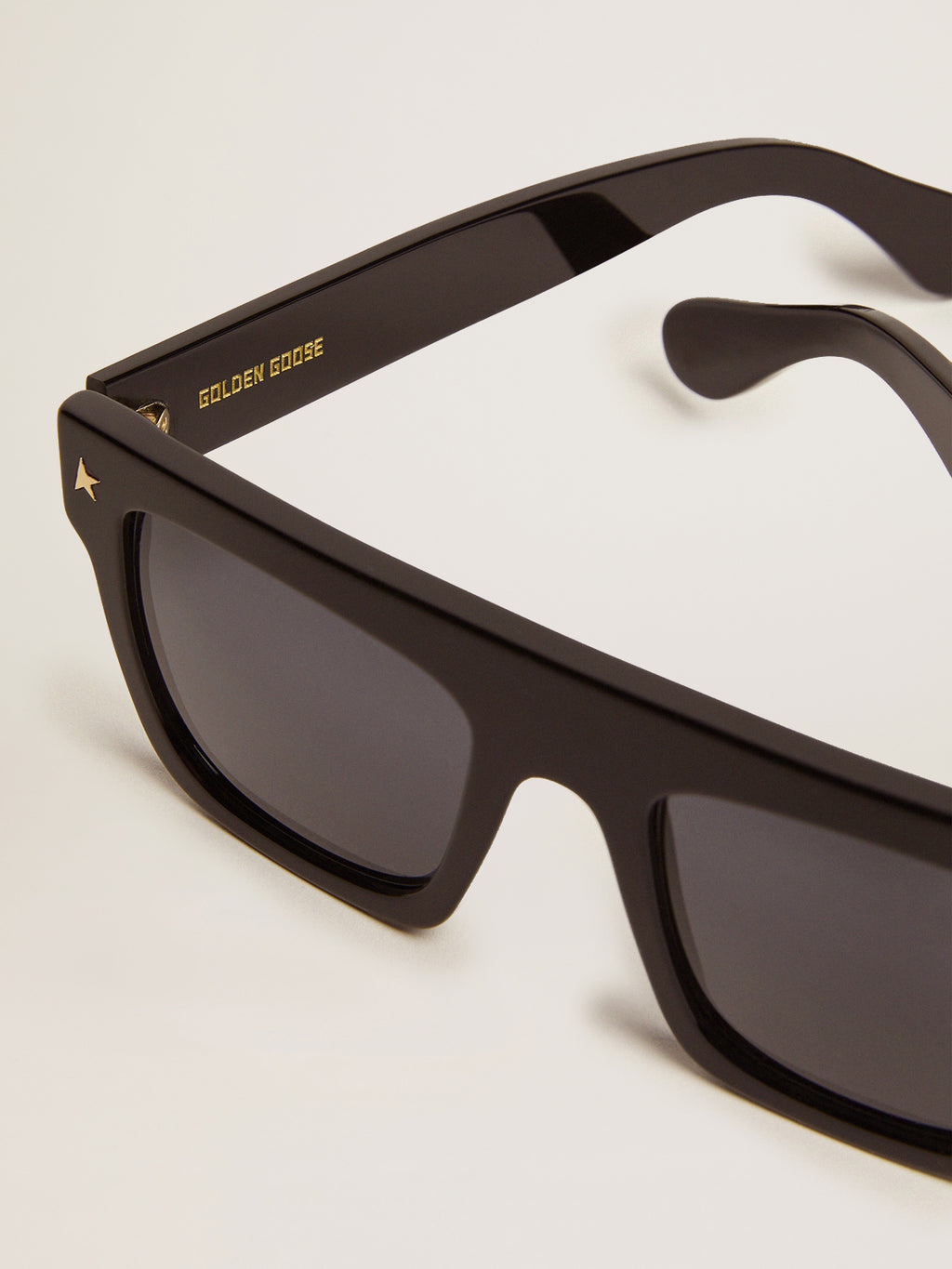 Square sunglasses with black frame and gold details| Golden Goose