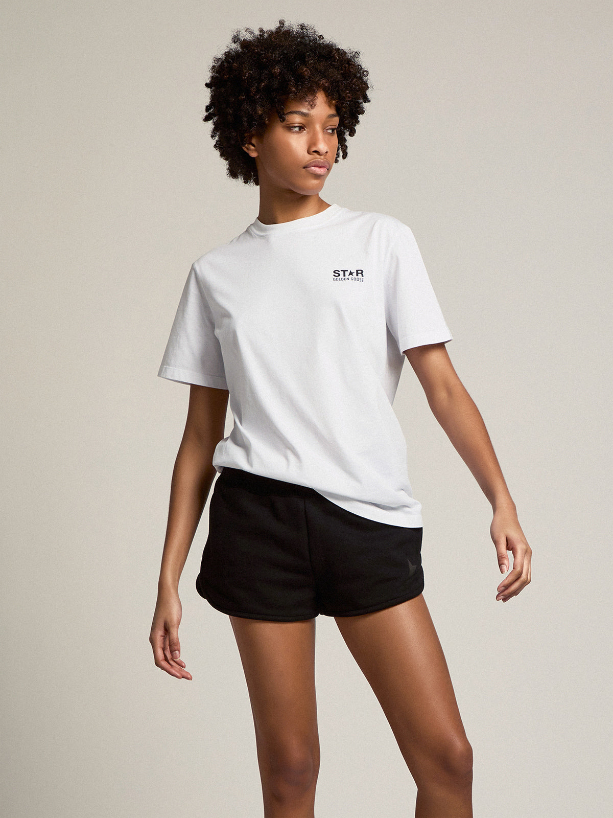 Women's white T-shirt with contrasting black logo and star| Golden Goose