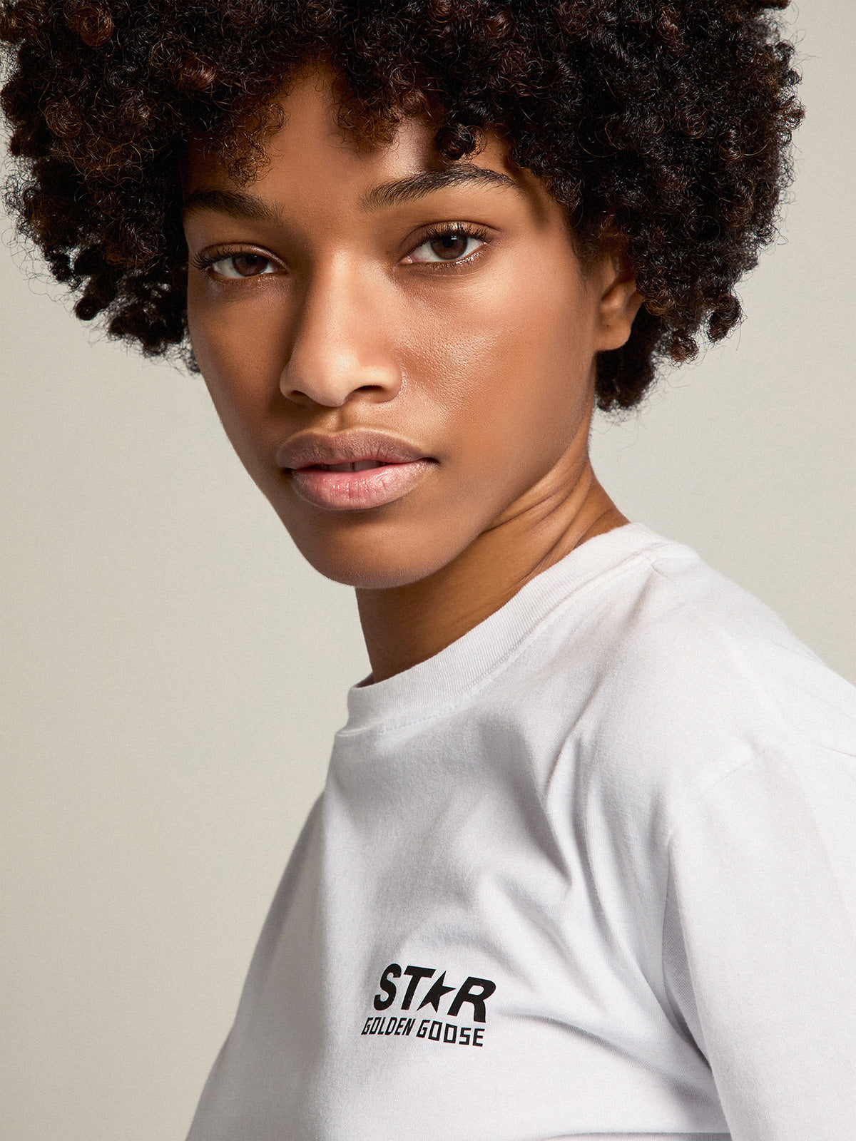 Women's white T-shirt with contrasting black logo and star| Golden Goose