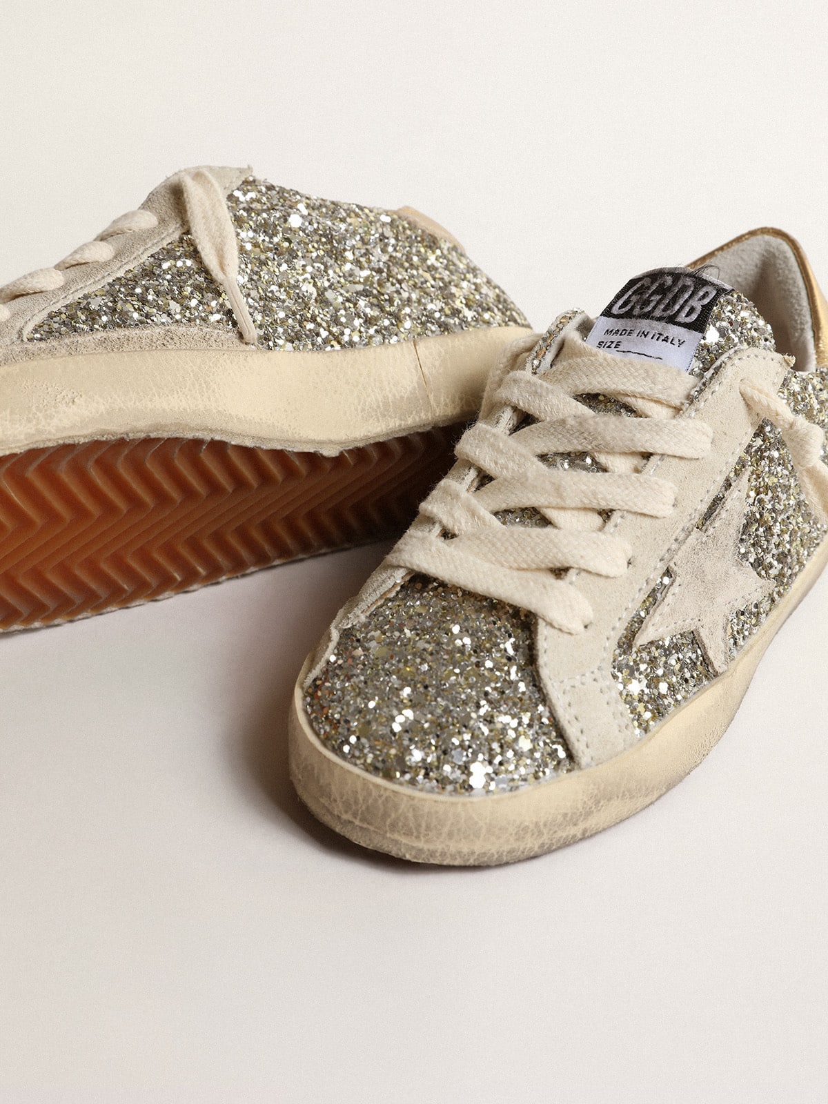 Super-Star Junior in glitter with a suede star and gold heel tab| Golden Goose