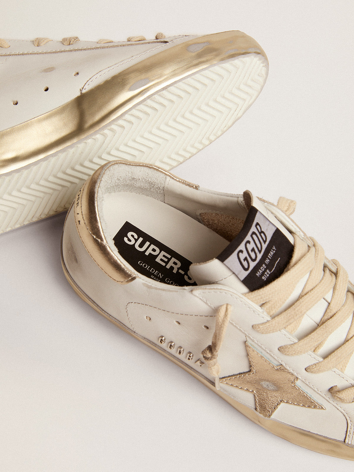 Women's Super-Star sneakers with gold foxing| Golden Goose