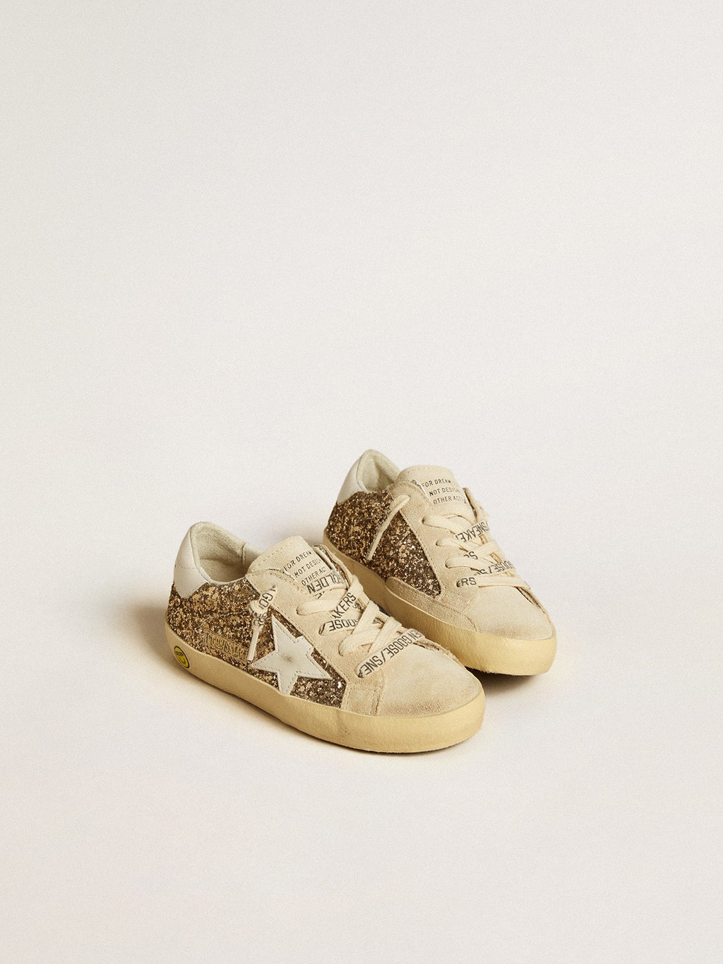 Super-Star Junior in gold glitter with white leather star and heel tab| Golden Goose