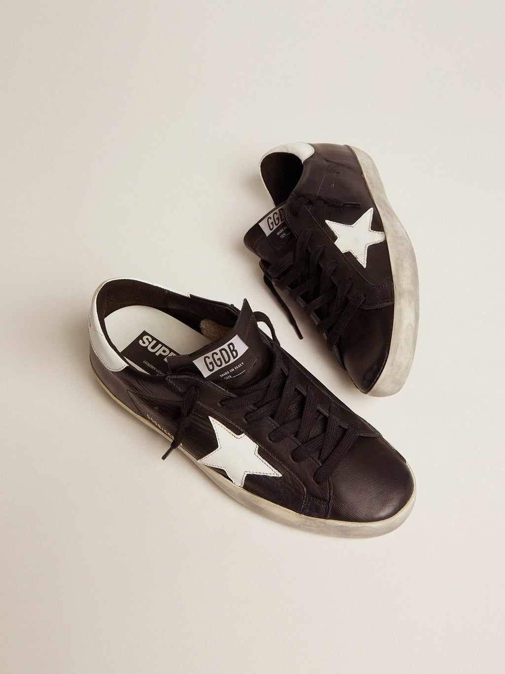 Women's Super-Star in black leather with white leather star and heel tab| Golden Goose
