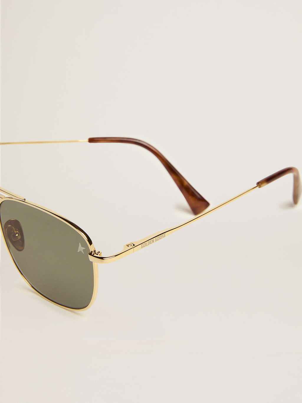 Aviator sunglasses with gold frame and green lenses| Golden Goose