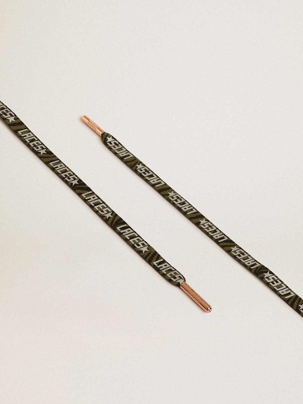 Green and black zebra-print laces with contrasting silver-colored 'Laces' lettering| Golden Goose