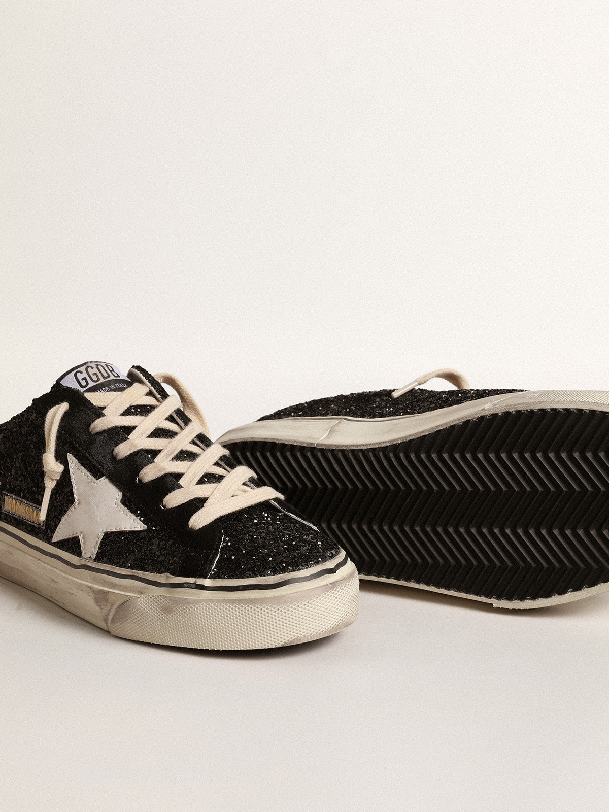 Super-Star Sabots in black glitter with white bio-based star| Golden Goose