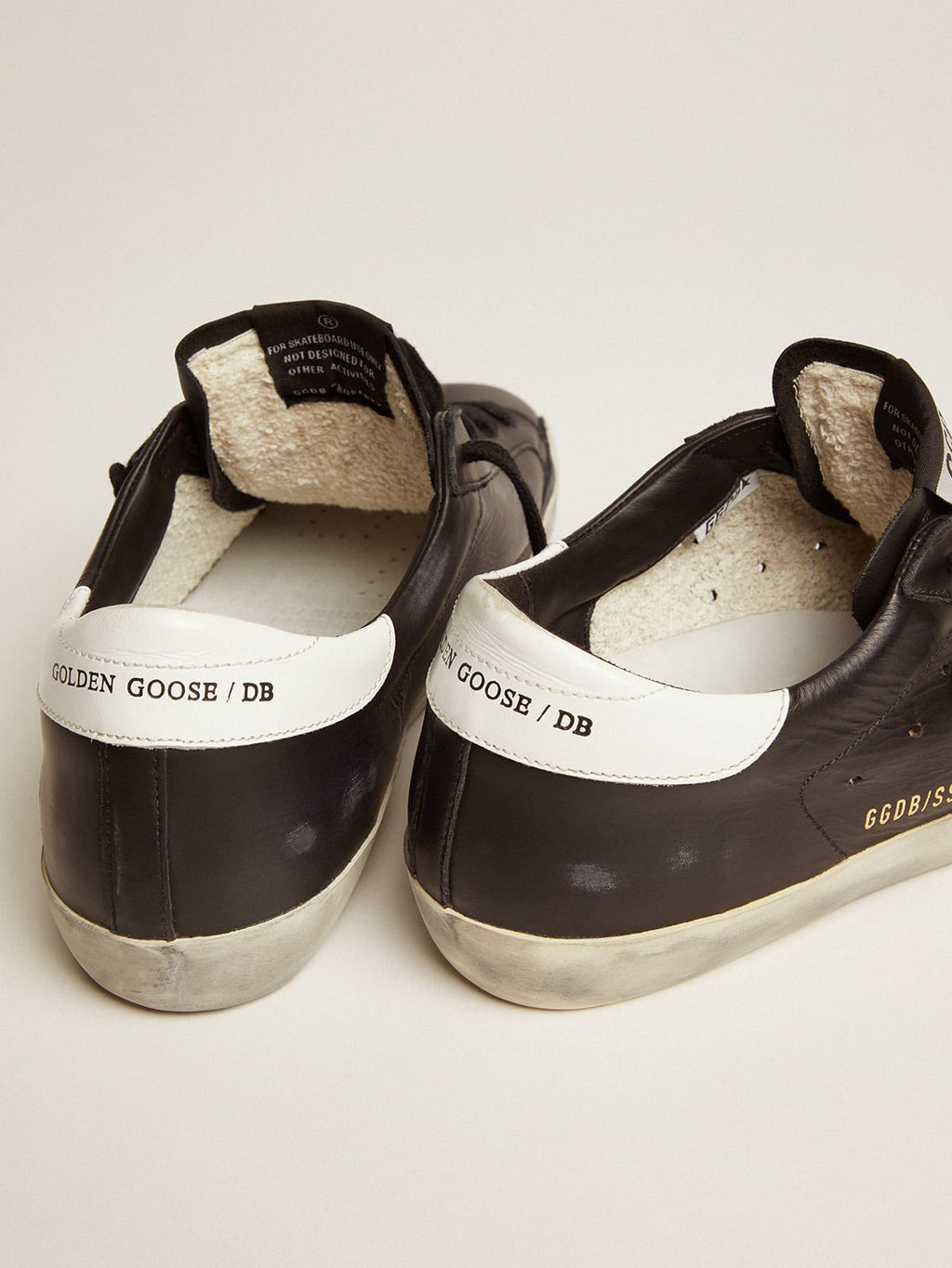 Women's Super-Star in black leather with white leather star and heel tab| Golden Goose