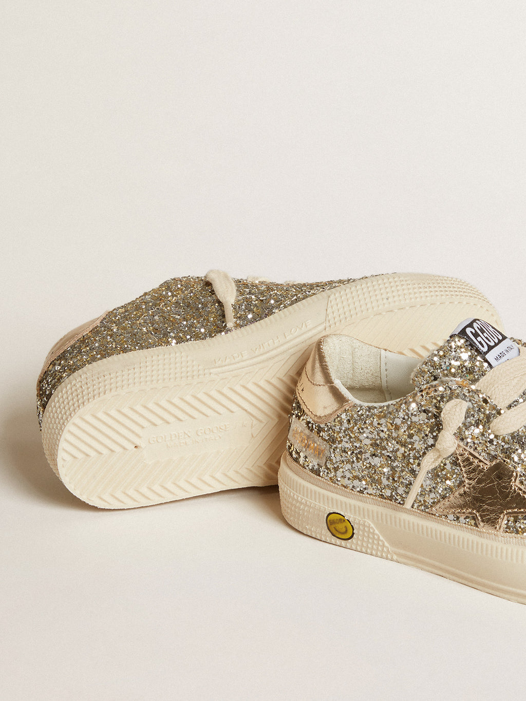 May Young in platinum glitter with metallic leather star and heel tab| Golden Goose