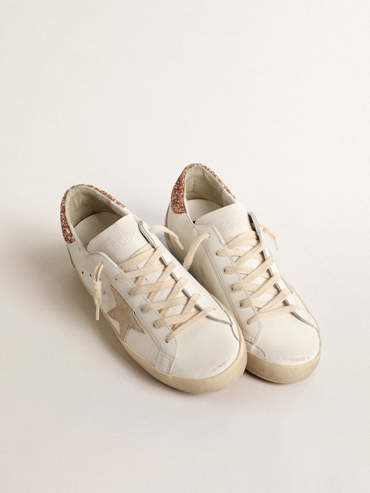 Super-Star with a suede star and peach-pink glitter heel tab| Golden Goose