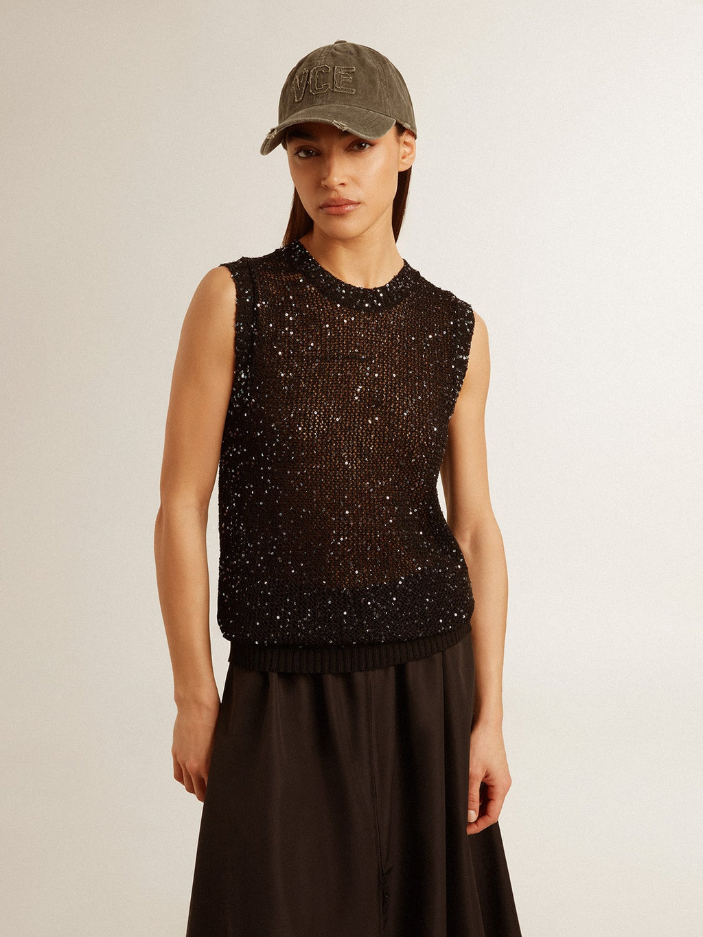 Black mesh knit top with sequins and contrasting details