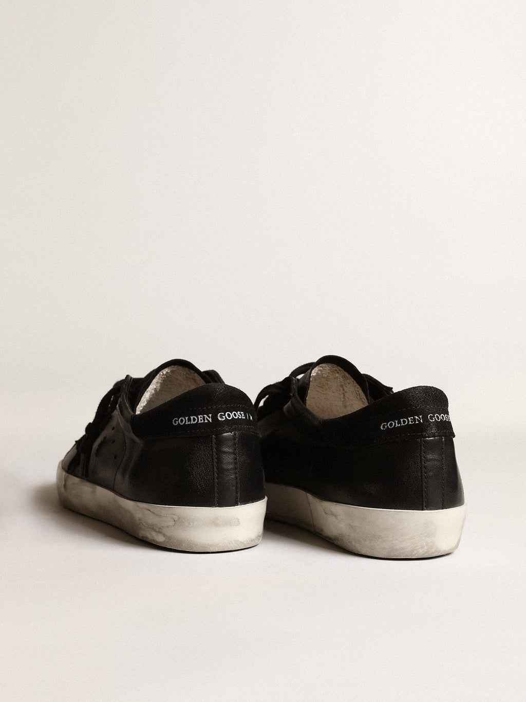 Men's Super-Star in black nappa with black suede star and heel tab| Golden Goose