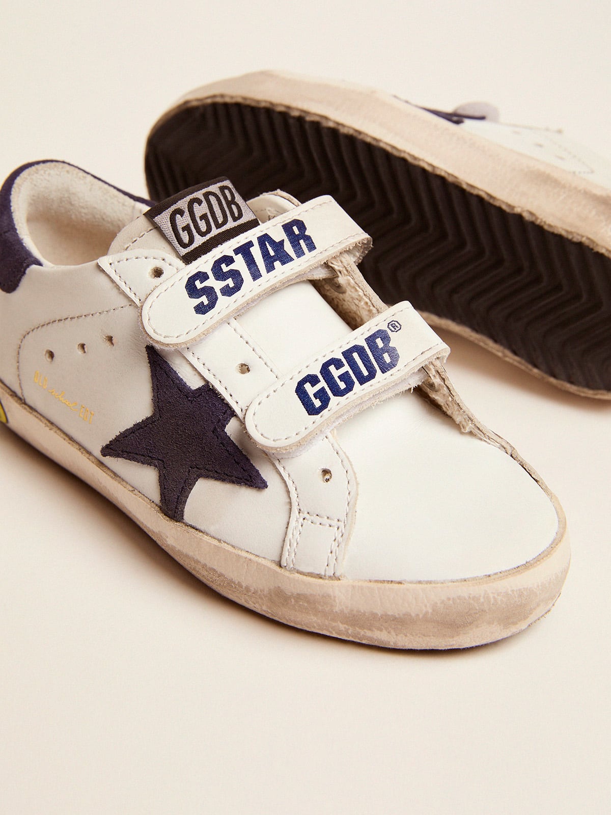 Old School Junior in white leather with blue suede star and heel tab| Golden Goose