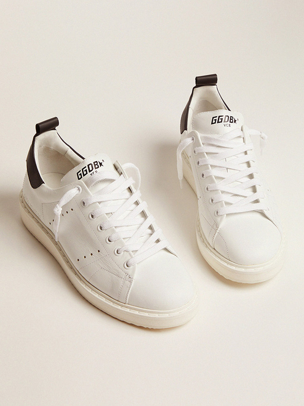 Starter sneakers in white leather with black leather heel tab| Golden Goose