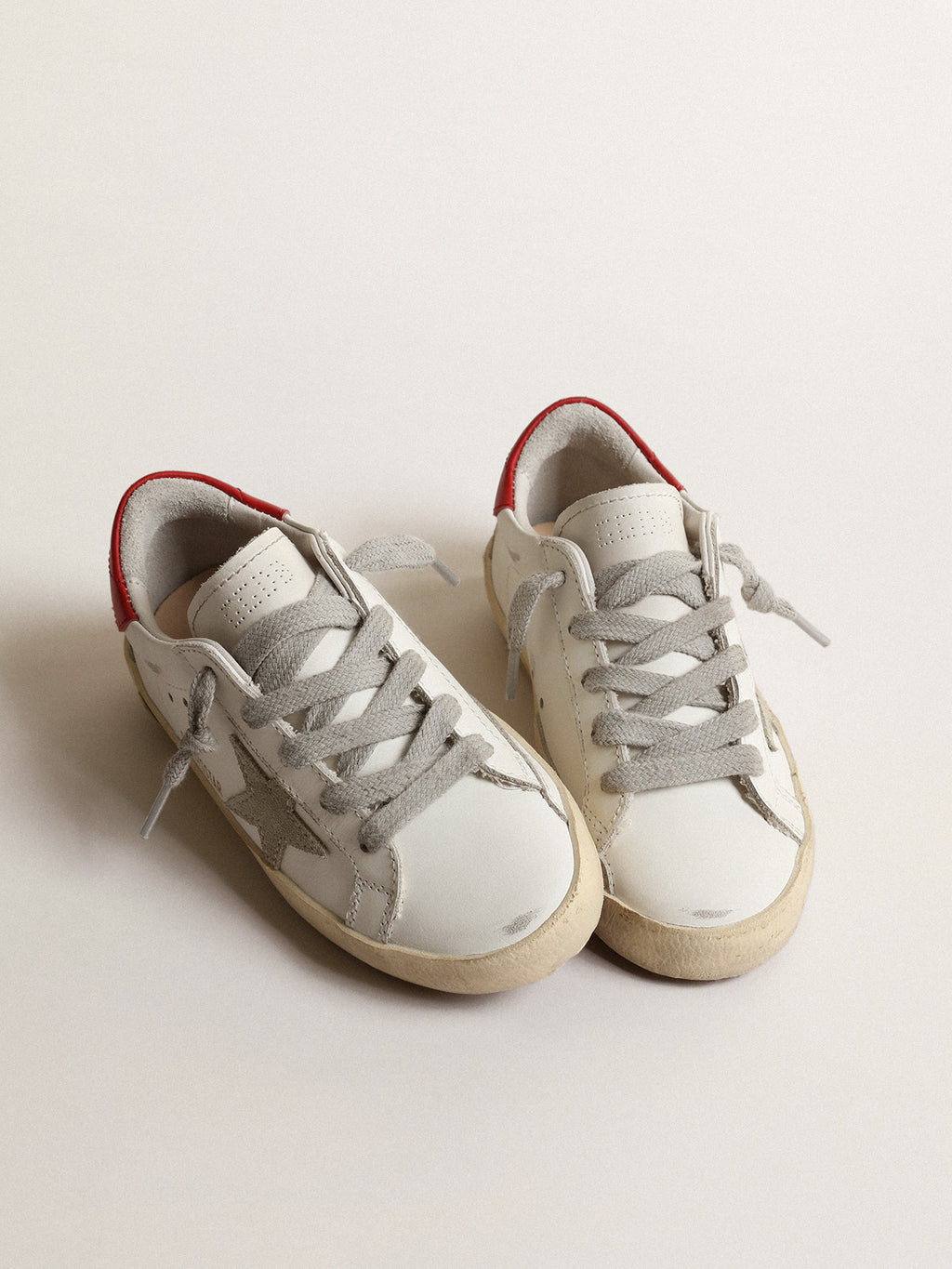 Super-Star Junior with suede star and red leather heel tab| Golden Goose
