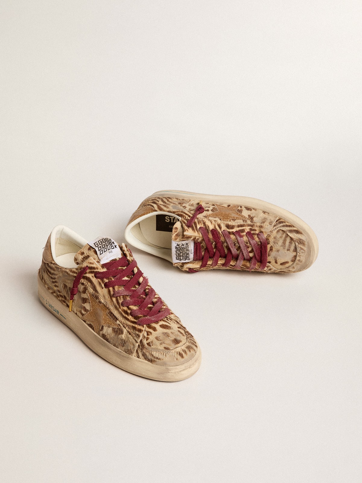 Women's Stardan LTD in animal-print pony skin with gold glitter star| Golden Goose